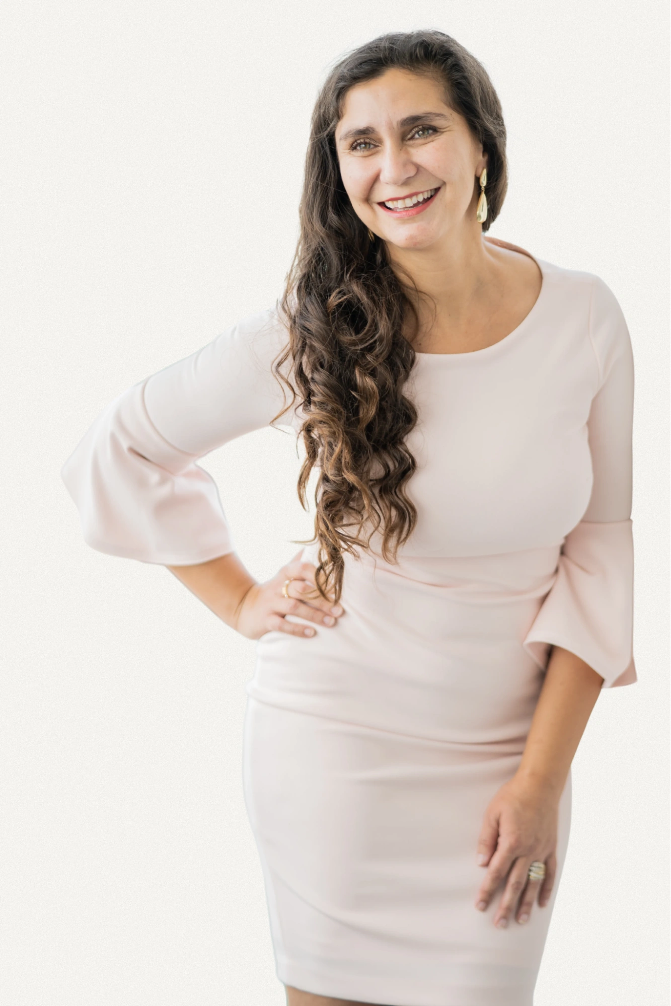 Mira Kelley smiling in a blush pink dress